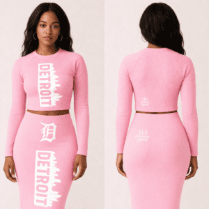 Front and back view of a 313 Emblems black ribbed two-piece set featuring a long-sleeve crop top and midi skirt. Both pieces display the white vertical "DETROIT" skyline graphic and Gothic "D" branding.